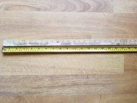 odd tape measure against yardstick.jpg